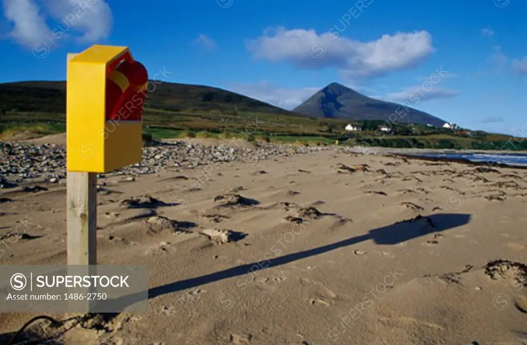 Inflatable ring in a wooden box on sand, Doogort, Achill Island, County Mayo, Ireland