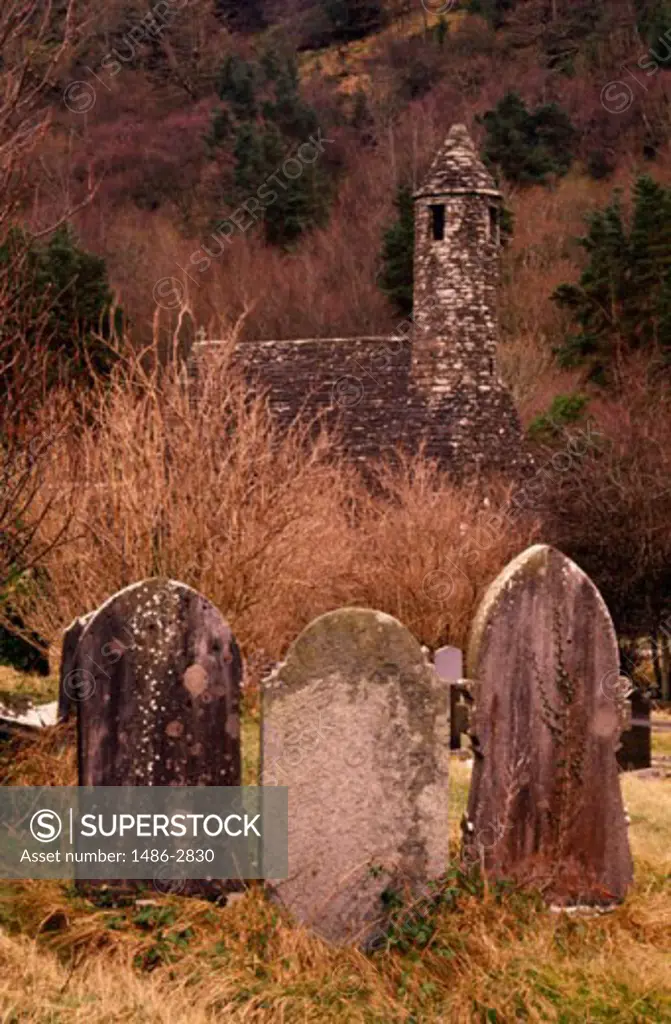Tombstones in a cemetery, St. Kevins Church, Glendalough National Park, County Wicklow, Ireland