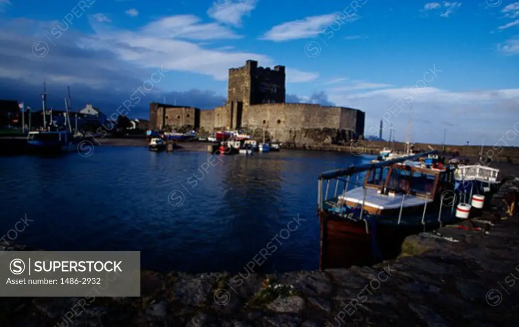 Boats in front of a castle, Carrickfergus Castle, Carrickfergus, County Antrim, Northern Ireland
