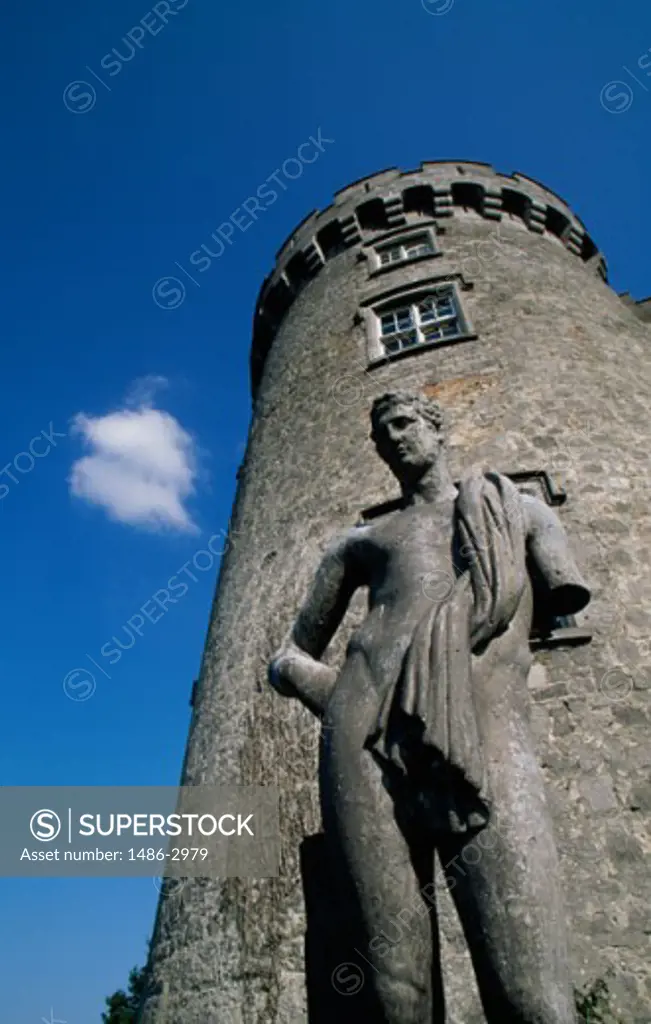 Low angle view of a statue in front of a tower, Kilkenny Castle, Kilkenny, Ireland