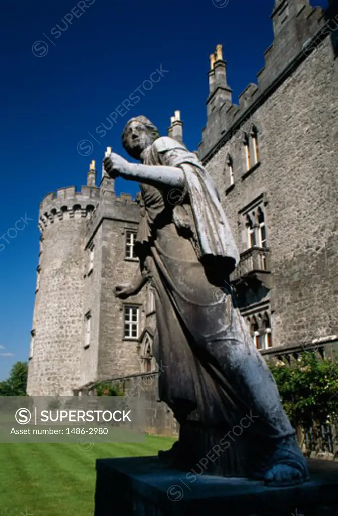 Low angle view of a statue in front of a castle, Kilkenny Castle, Kilkenny, Ireland
