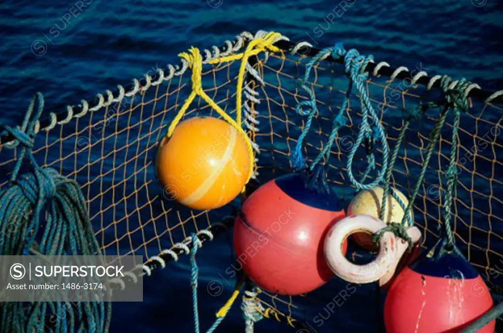 A fishing net on a metal frame with buoys, Ireland