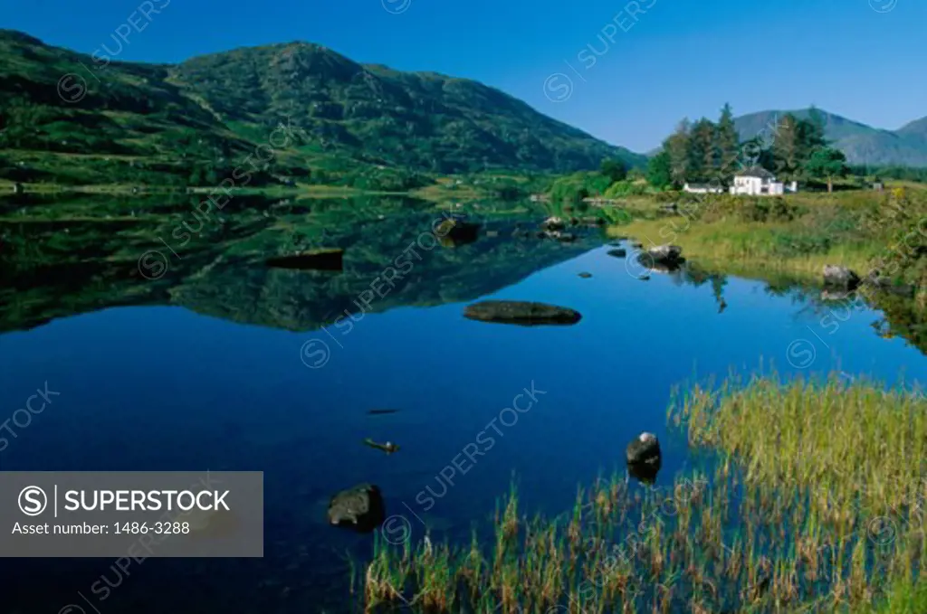 Reflection of a hill in a lake, Looscaunagh Lake, Ireland