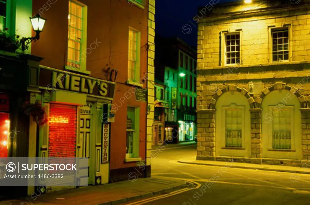 Stores lit up at night, New Ross, Ireland