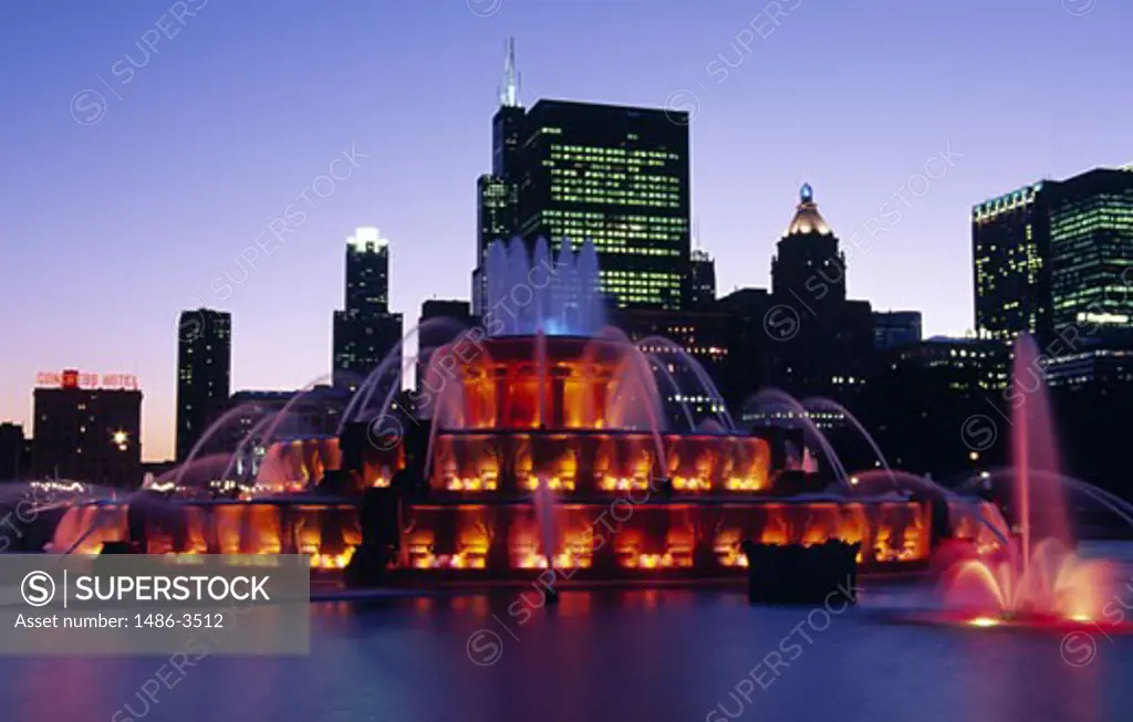 USA, Illinois, Chicago, Grand Park, Buckingham Fountain illuminated during dusk