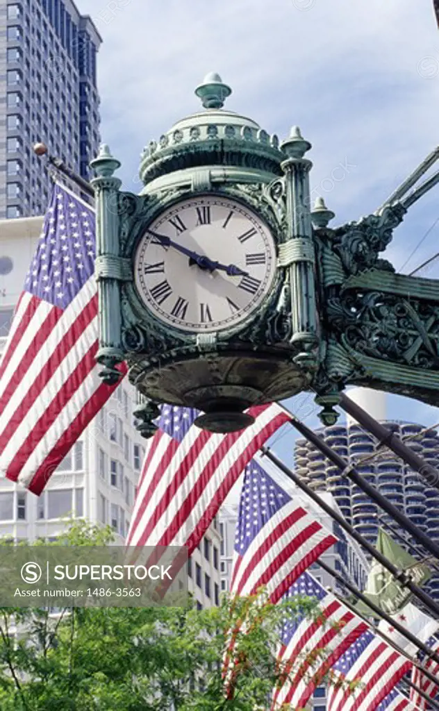 USA, Illinois, Chicago, old fashioned-clock and American flags