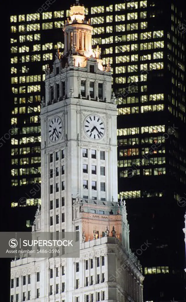 USA, Illinois, Chicago, Wrigley Building, clock tower against modern office building