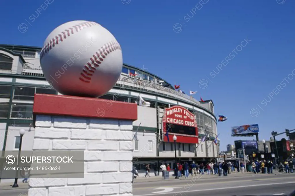 Low angle view of a sculpture of a baseball in front of a stadium, Wrigley Field, Chicago, Illinois, USA