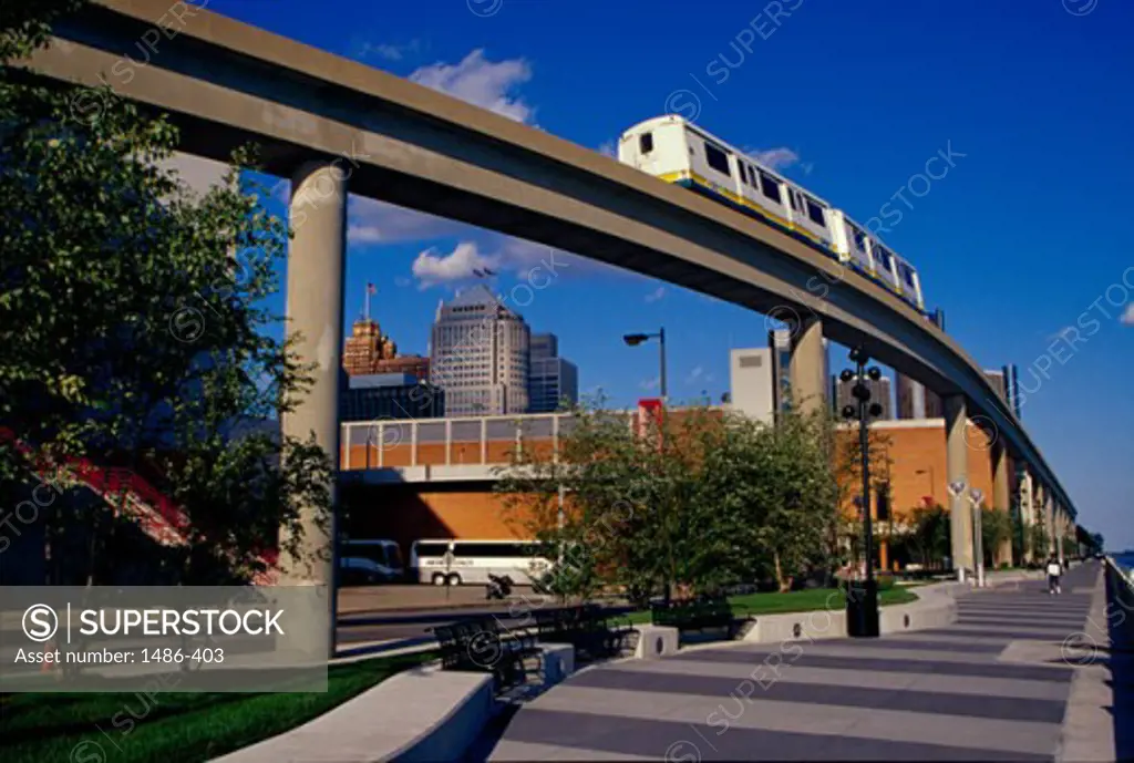 Low angle view of a passenger train on an elevated railway track, Detroit, Michigan, USA