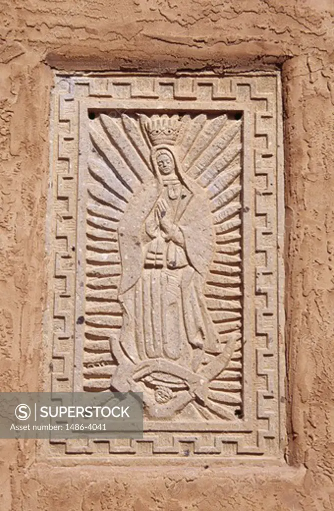 USA, New Mexico, Taos, Our Lady of Guadalupe Church, bas-relief representing Virgin Mary, close-up