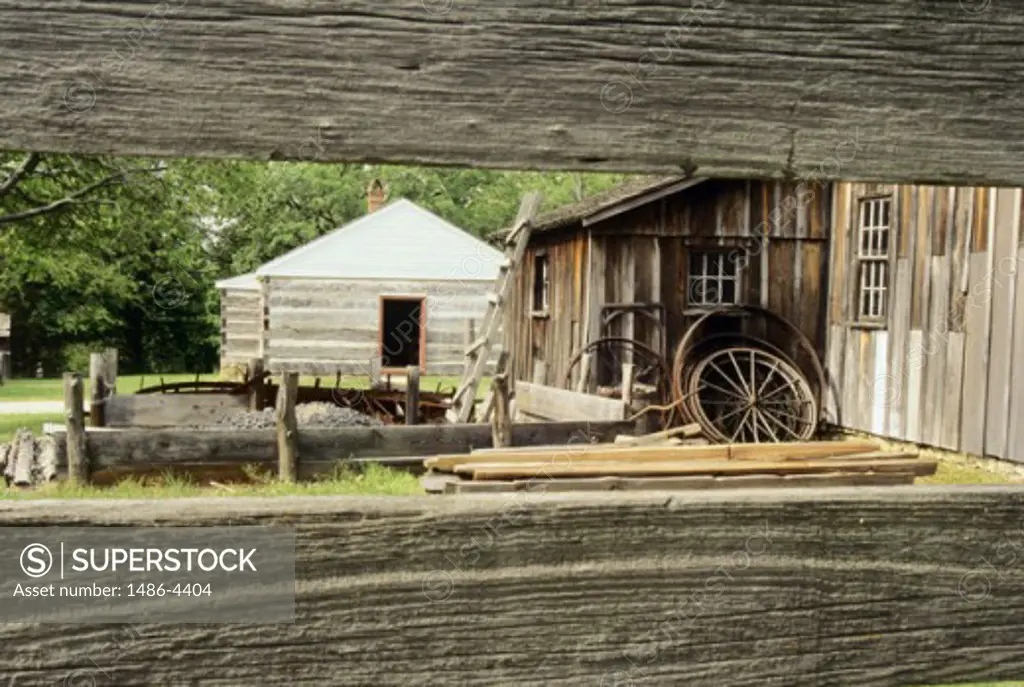 Wooden cabins seen through a wooden fence, Fleming Park, Kansas City, Missouri, USA