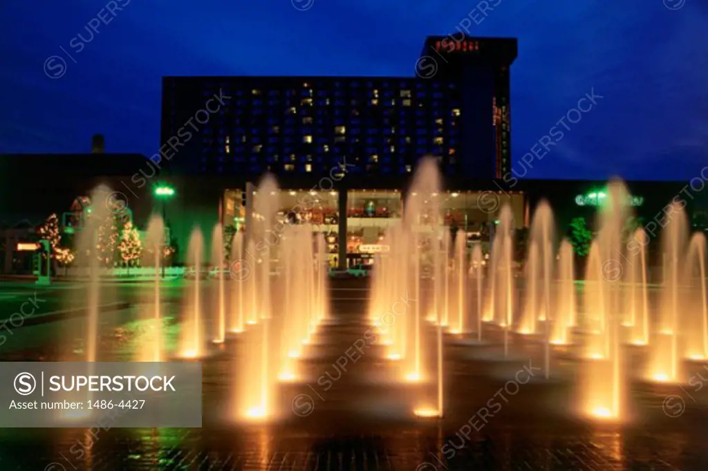 Fountains lit up at night in front of a building, Crown Center, Kansas City, Missouri, USA