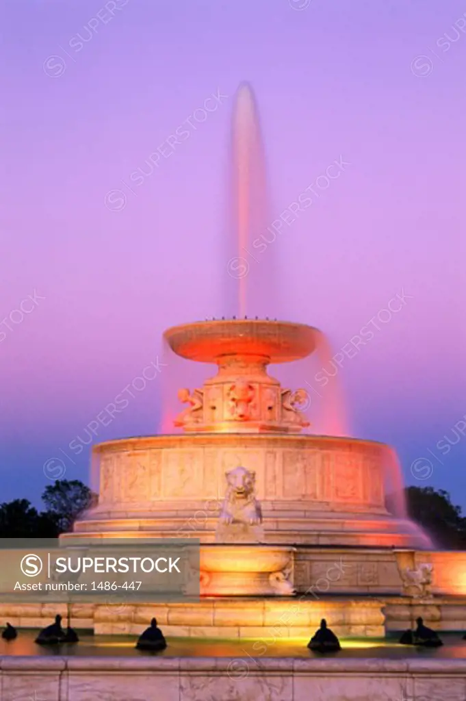 Low angle view of a fountain lit up at dusk, Scott Memorial Fountain, Belle Isle Park, Detroit, Michigan, USA