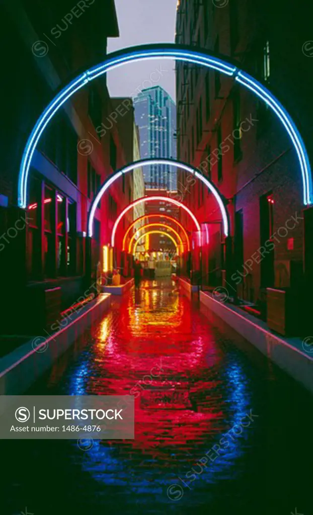 USA, Texas, Dallas, neon arch reflections in city