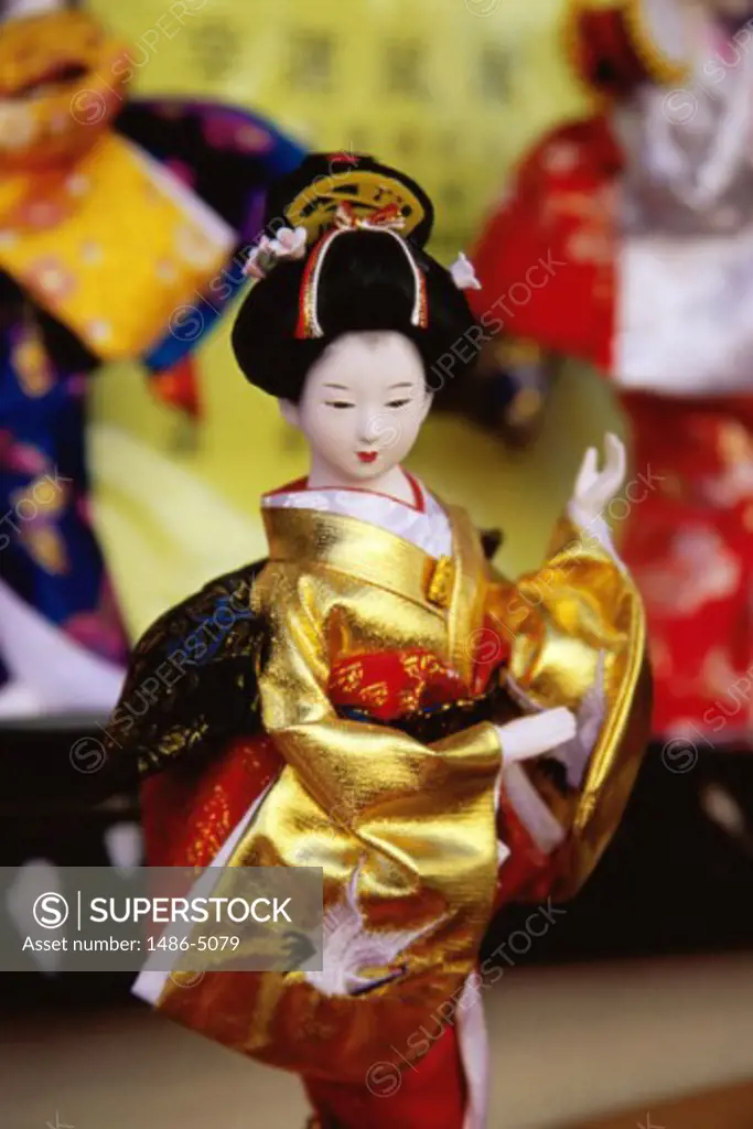Close-up of a figurine of a geisha