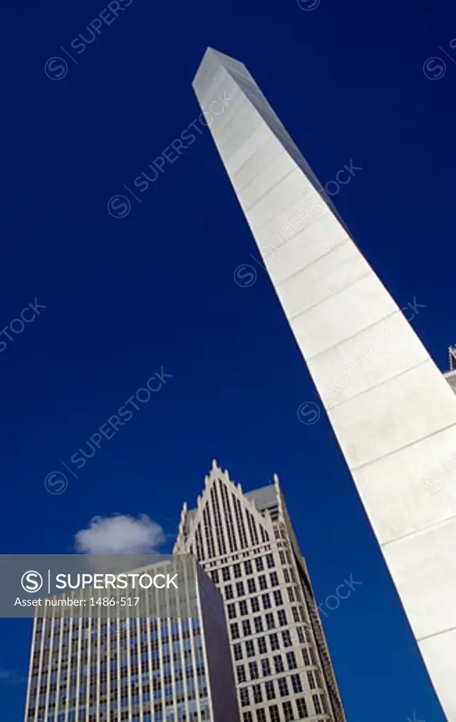 Obelisk in front of buildings, Detroit, Michigan, USA