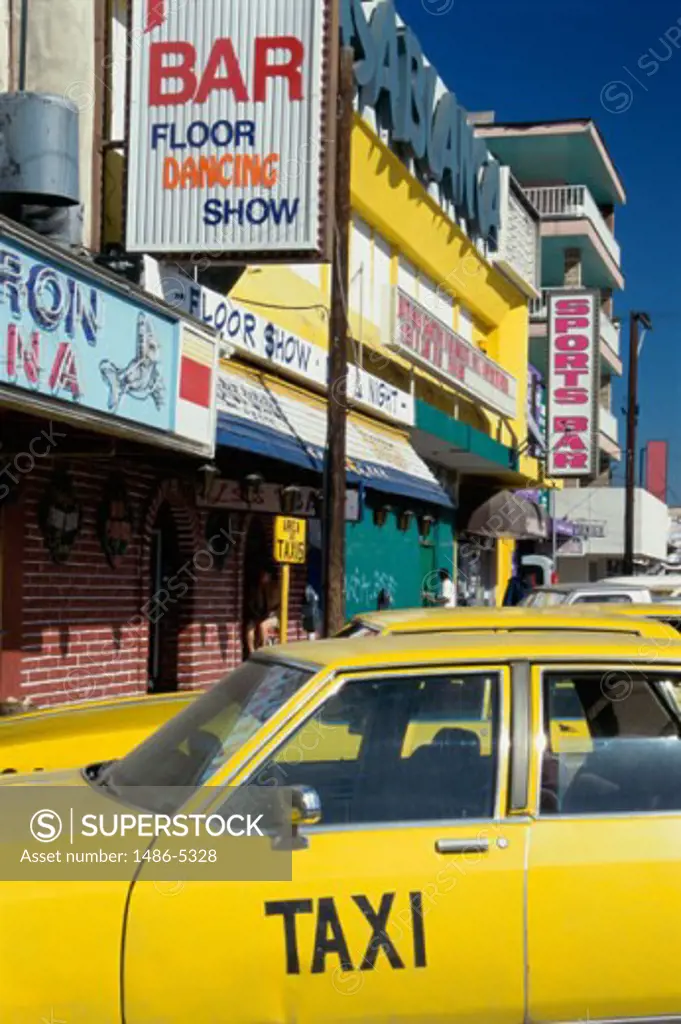 Taxis parked in front of a bar, Tijuana, Mexico