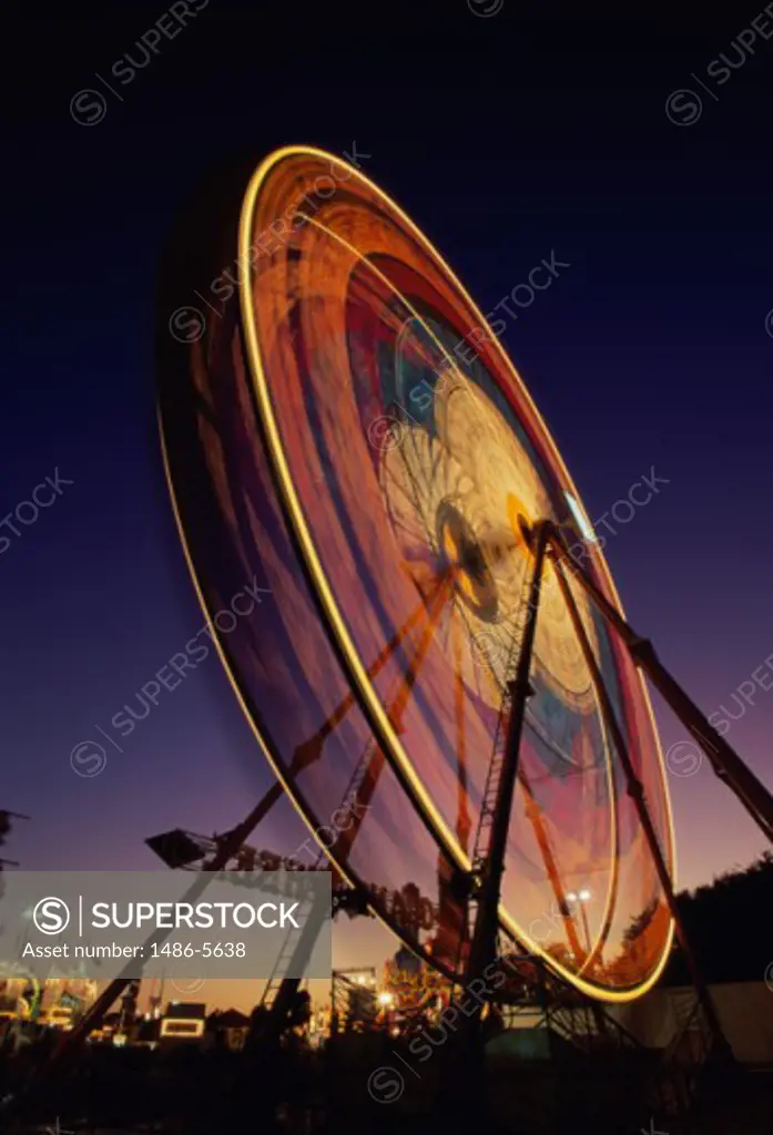 Low angle view of a ferris wheel lit up at night, Orange County Fair, Costa Mesa, California, USA