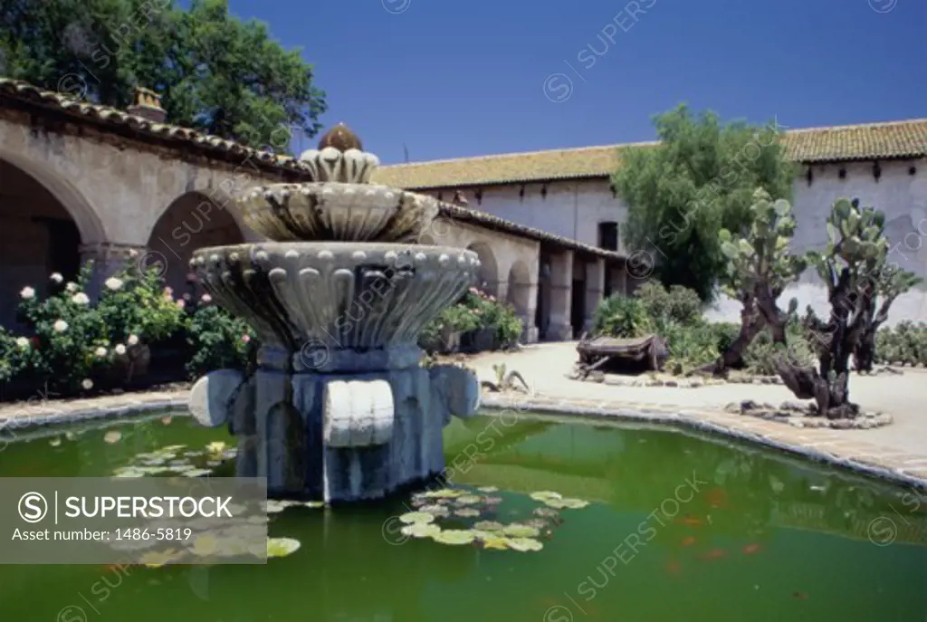 Fountain in the courtyard of a church, Mission San Miguel Arcangel, San Miguel, California, USA