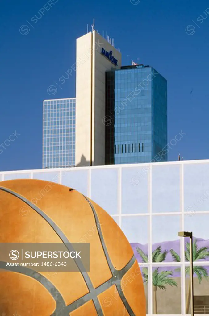 USA, Arizona, Phoenix, Skyscrapers with basketball painting in foreground