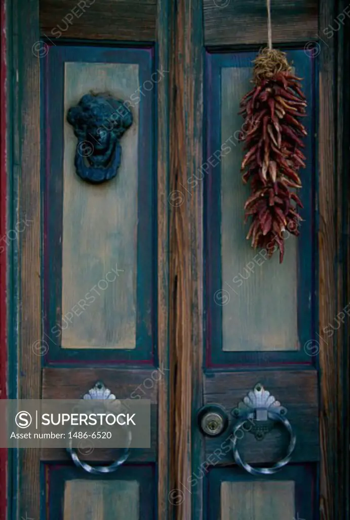 Close-up of a door with red peppers suspended from it, Tucson, Arizona, USA