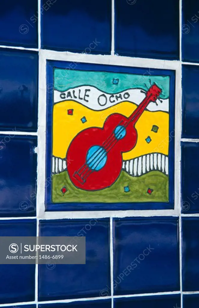 USA, Florida, Miami, tiled wall with illustration of guitar