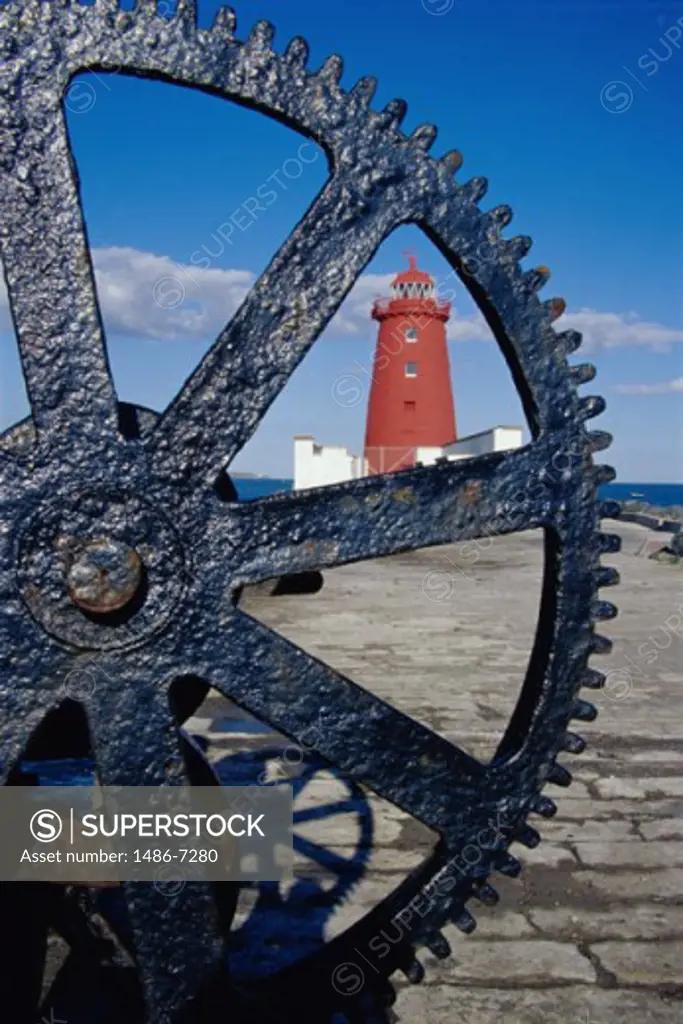 Lighthouse viewed through the spokes of a wheel, Poolbeg Lighthouse, Dublin, Ireland