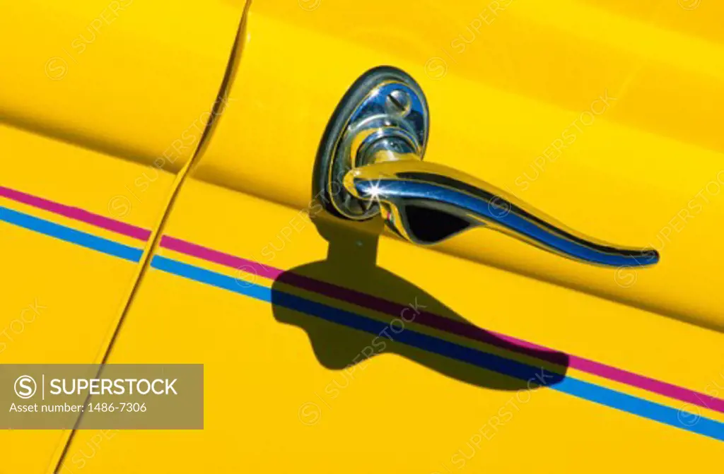 Close-up of a handle of an antique car