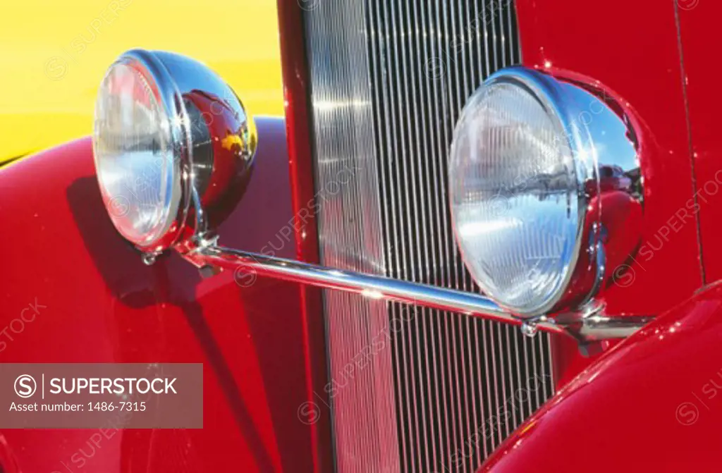 Close-up of the headlights of an antique car