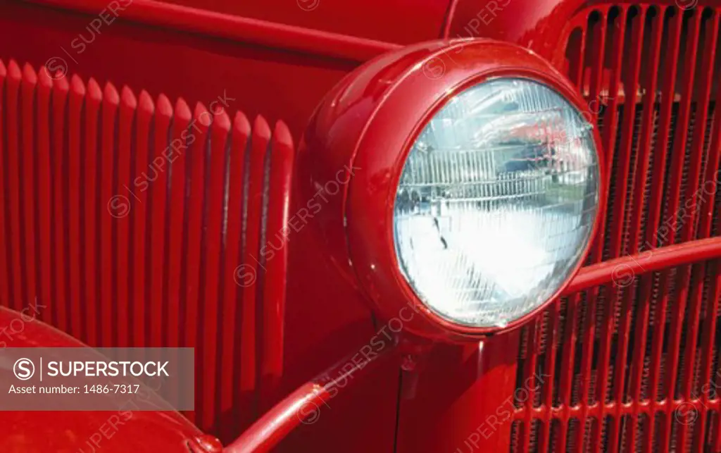Close-up of the headlight of an antique car