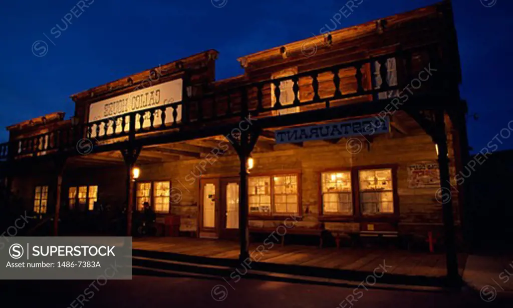 Restaurant building lit up at night, Calico, California, USA