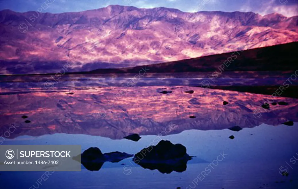 Reflection of mountain range in water, Death Valley National Park, California, USA