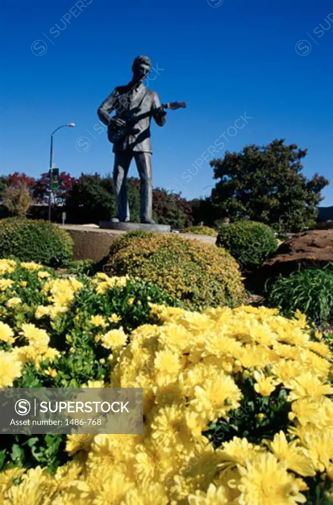 Statue in a formal garden, Buddy Holly Statue, Lubbock, Texas, USA