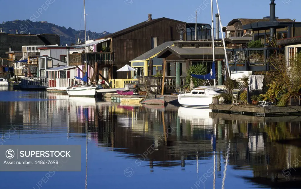 Reflection of houses in water, Sausalito, California, USA