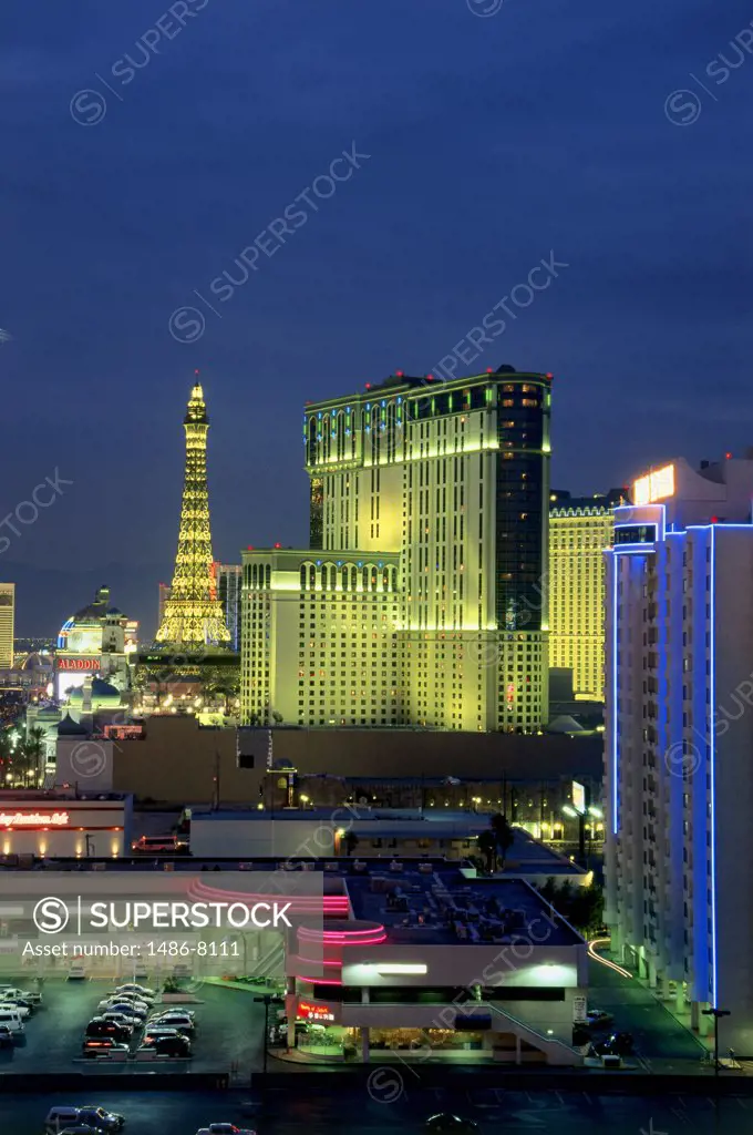 High angle view of an Eiffel Tower replica with buildings lit up at night, Las Vegas, Nevada, USA