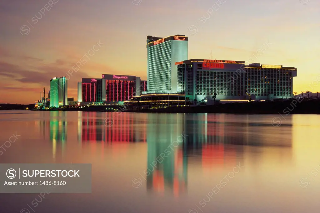 Skyscrapers in a city lit up across the Colorado River, Laughlin, Nevada, USA