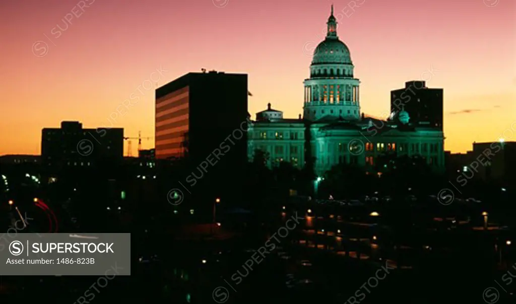 Government building lit up at dusk, Texas State Capitol, Austin, Texas, USA