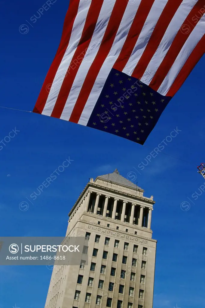 Low angle view of the American Flag flying over the Civil Courts Building, St. Louis, Missouri, USA
