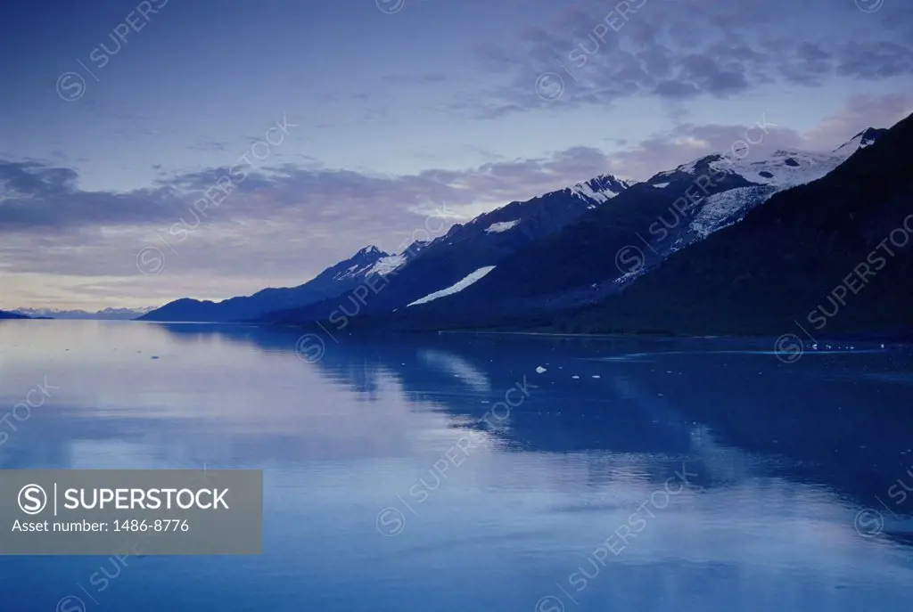 Reflection of mountains in water, College Fjord, Alaska, USA