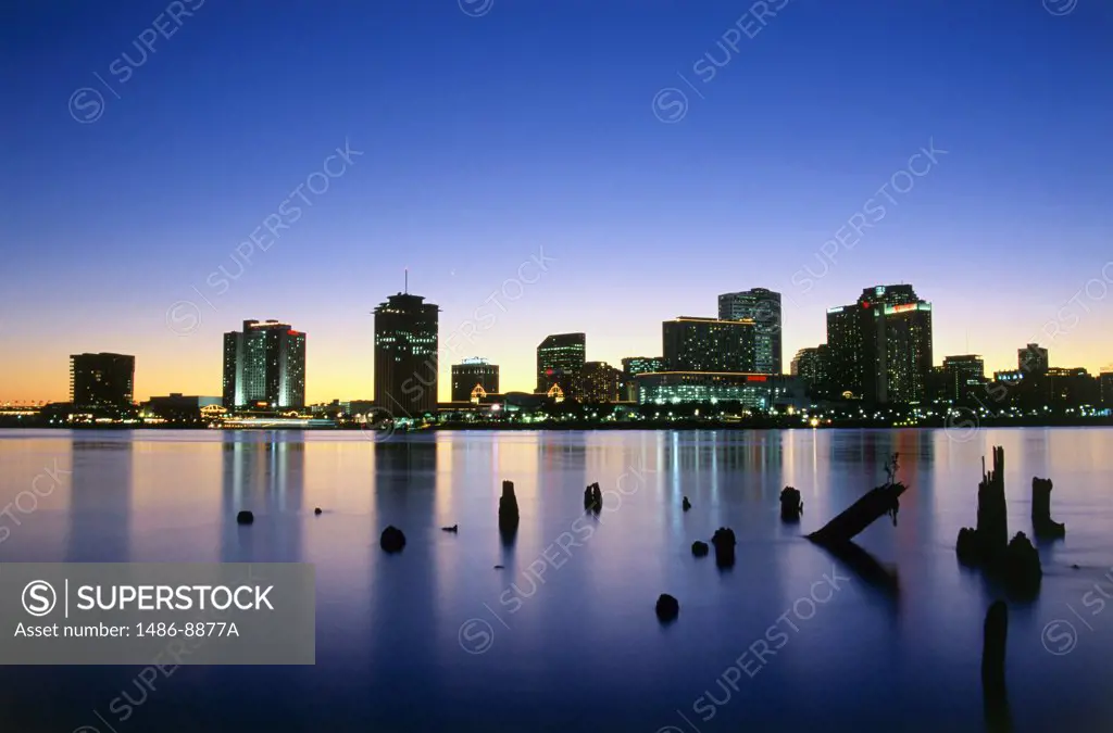 Buildings on the waterfront lit up at night, Mississippi River, New Orleans, Louisiana, USA