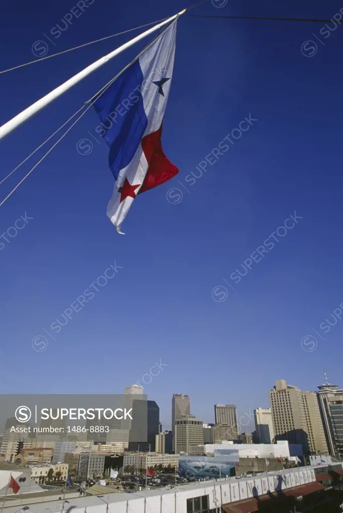 Panamanian flag with city in the background, New Orleans, Louisiana, USA