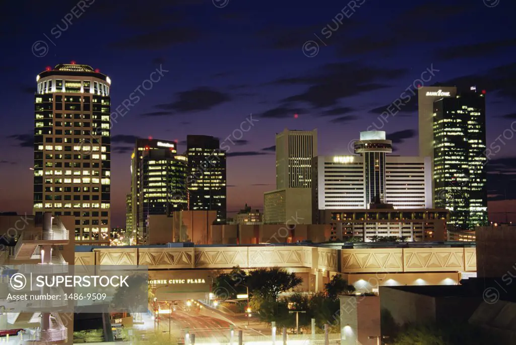 Skyscrapers in a city lit up at night, Phoenix, Arizona, USA