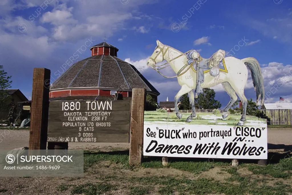 Information sign with a horse statue in front of a building, 1880 Town, South Dakota, USA