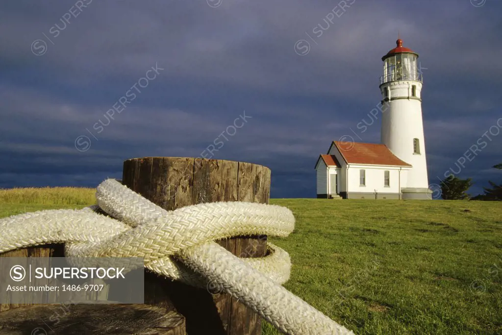 Close-up of a rope tied around a wooden post near a lighthouse, Cape Blanco Lighthouse, Cape Blanco State Park, Oregon, USA