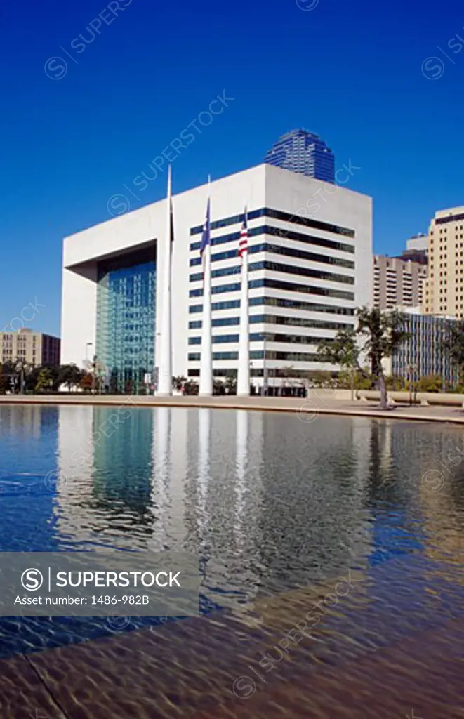 Reflection of a government building in water, Dallas City Hall Plaza, Dallas, Texas, USA