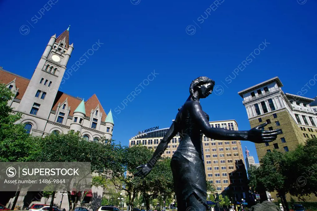 Low angle view of a statue in front of buildings, Rice Park, St. Paul, Minnesota, USA