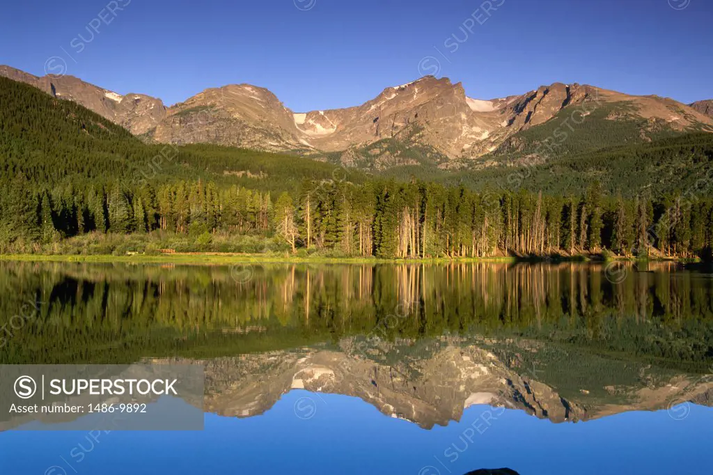 Reflection of mountains and trees in a lake, Sprague Lake, Rocky Mountain National Park, Colorado, USA