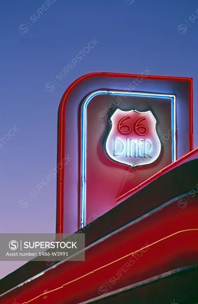 USA, New Mexico, Albuquerque, 66 Diner neon sign against sky
