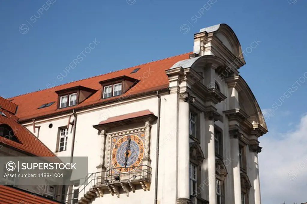 Mosaic clock on building wall, Old Town Square, Poznan, Poland