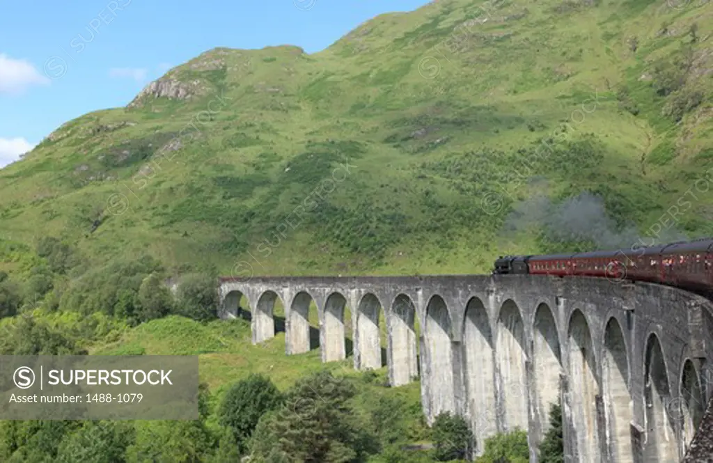 Jacobite steam train passes over Glenfinnan Viaduct, Glenfinnan, Lochaber, Highlands Region, Scotland